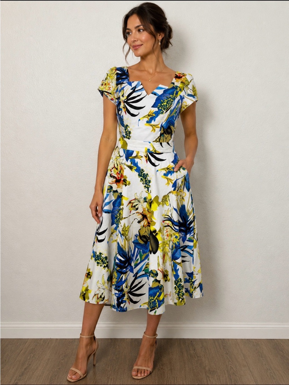 Tropical floral fit and flair dress. White blue yellow print   size medium.
